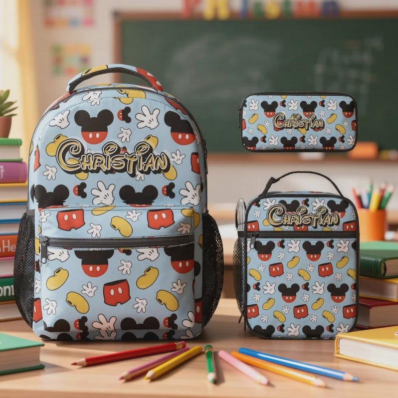 May include: A light blue backpack, pencil case, and lunch bag set featuring a Mickey Mouse pattern. The set includes a backpack with a front pocket and side mesh pockets, a pencil case, and a lunch bag. The name "Christian" is printed on each item.