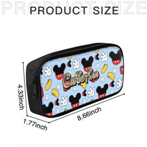 May include: A black pencil case with a blue background featuring Mickey Mouse heads, gloves, and beans. The name "CHRISTIAN" is printed in gold. The case measures 8.66 inches long, 4.33 inches high, and 1.77 inches wide.