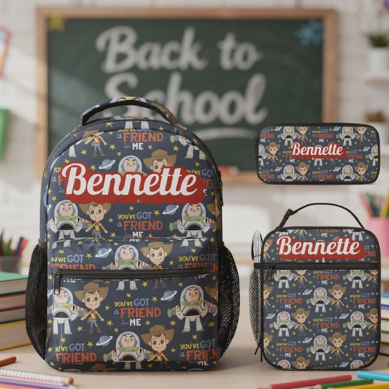 May include: A dark blue backpack, lunch bag, and pencil case set featuring a repeating pattern of Woody and Buzz Lightyear characters, stars, and planets. Each item displays the name Bennette in red script and the text You've Got a Friend in Me.