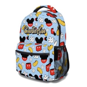 May include: A light blue backpack featuring a pattern of Mickey Mouse heads, gloves, and other elements. The backpack has a front pocket, side mesh pocket, and the name "Christian" in gold script. The handle and zipper pulls are red.