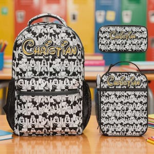 May include: A black and white backpack, pencil case, and lunch bag set. The set features a repeating pattern of Mickey Mouse illustrations. The name "Christian" is written in gold script across each item. The backpack has a mesh side pocket.