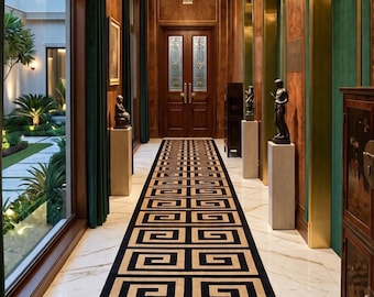 May include: A long hallway featuring a runner rug with a black and beige geometric Greek key pattern. The space includes white marble flooring, wood-panelled walls with green accents, two crystal chandeliers, and arched alcoves with statues.