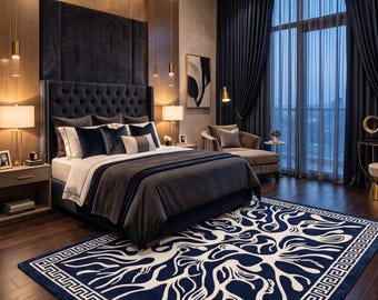 May include: A rectangular area rug featuring a deep navy blue background with a prominent white abstract coral-like pattern and a geometric Greek key border, positioned on a dark wood floor in a bedroom with a tufted headboard.