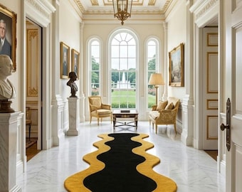 May include: A long, runner rug featuring a bold, wavy design in contrasting black and yellow. The rug is positioned on a white marble floor in a grand hallway, extending from the foreground towards a large window with a view of a fountain.