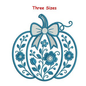 May include: An embroidery design of a pumpkin outlined in blue thread, featuring a white bow at the top stem and blue floral patterns with leaves and berries filling the interior. The text "Three Sizes" is printed in red above the pumpkin.