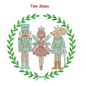 May include: An embroidered design featuring three characters from The Nutcracker ballet: a nutcracker soldier, a fairy, and a mouse king, surrounded by a green wreath. The text "Two Sizes" is at the top. The characters are in pastel colors.