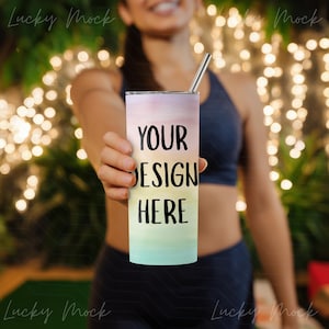 May include: A tall, stainless steel tumbler with a pastel watercolour design in shades of pink, yellow, and blue. The text "YOUR DESIGN HERE" is printed in black. The tumbler has a silver straw.