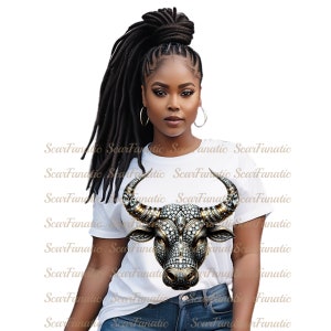 May include: A woman wearing a white t-shirt with a rhinestone-encrusted bull's head graphic. The bull's head is gold and silver with a diamond-like pattern.