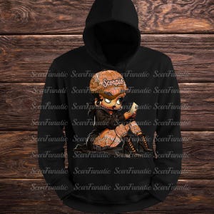 May include: Black hoodie featuring a cartoon character wearing a hat with "Scorpio" printed on it. The character is holding a small object. The design is in shades of brown and black.