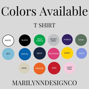 May include: Image displays a color chart for T-shirts, with a light gray background. The text "Colors Available" and "T SHIRT" are at the top. Color options are presented in circles, including white, black, green, grey, purple, sage, sky blue, royal blue, navy, and more. The brand name "MARILYNNDESIGNCO" is at the bottom.