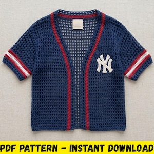 May include: Navy blue crochet baseball jersey with red and white accents. Features a white "NY" logo on the chest and red trim along the front and collar. The sleeves have red and white stripes.