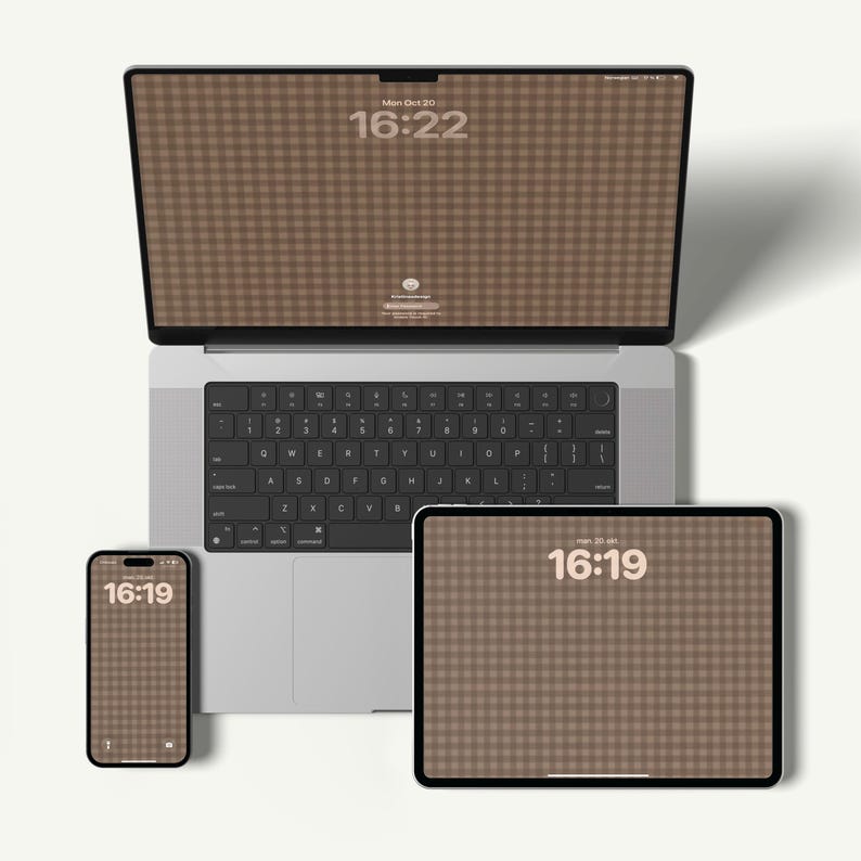 May include: A laptop, tablet, and smartphone are displayed, each with a brown gingham pattern on their screens. The laptop screen displays "Mon Oct 30 16:22", while the tablet and phone show "16:19". The devices are arranged on a white surface.