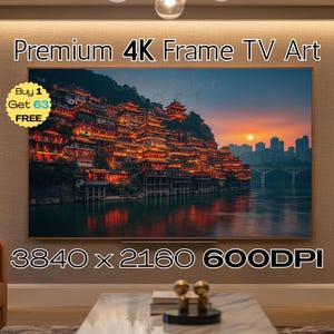 May include: A framed 4K TV art piece displays a vibrant sunset over a city with traditional architecture. The image features warm orange and red hues, with the text "Premium 4K Frame TV Art" at the top. The resolution is 3840 x 2160 600DPI.