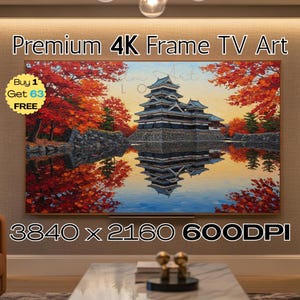 May include: A framed 4K TV art piece shows a colourful painting of a Japanese castle reflected in water, with red and orange autumn foliage. The artwork is labelled "Premium 4K Frame TV Art" with a "Buy 1 Get 63 FREE" offer.