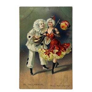 Postal vintage Tuck's en el carnaval La música tiene encantos 1908