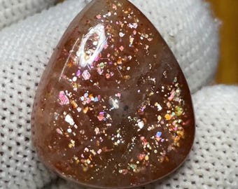 Regenbogen Feuer Konfetti Sonnenstein Cabochon | Auffälliger gepunkteter Feuer funkelnder Edelstein für die Schmuckherstellung (21x17x6MM)