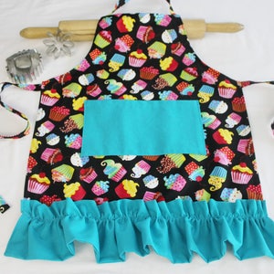 Colorful Cupcakes on Black Ruffled Child Apron with teal pocket and ruffle - ready to ship