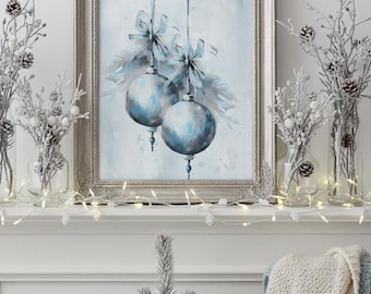 May include: A framed painting of two blue Christmas ornaments with bows, displayed on a white mantel. The mantel is decorated with frosted branches, fairy lights, and a small Christmas tree. A cozy blanket is draped nearby.