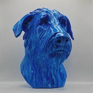 May include: A blue dog sculpture with a distinctive marbled effect. The dog's head is the focal point, with detailed features such as the ears, nose, and fur. A striking piece of art.