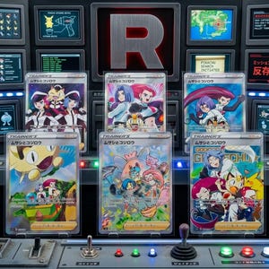 May include: A display of six Pokémon trading cards featuring Team Rocket characters and Pokémon. The cards are in protective cases, with Japanese text and colorful illustrations. The background includes control panels and screens with related graphics.