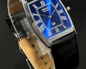 Reloj de pulsera vintage Seiko Slim Tank para hombre: esfera con números romanos y movimiento de cuarzo.
