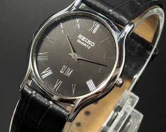 Reloj Seiko Tank de cuarzo vintage: esfera negra, correa de piel