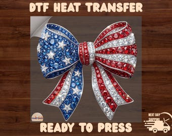 May include: A DTF heat transfer design featuring a bow with a patriotic theme. The bow is adorned with red, white, and blue gemstones, with a design reminiscent of the American flag. The text "READY TO PRESS" is also visible.