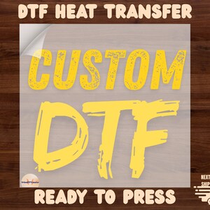 May include: A clear sheet with the words "DTF HEAT TRANSFER" at the top and "READY TO PRESS" at the bottom. The words "CUSTOM DTF" are in large, distressed yellow letters. A logo is in the bottom left corner.