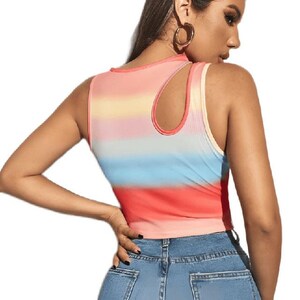 May include: A sleeveless crop top with a colorful, horizontal striped pattern in shades of red, orange, yellow, blue, and pink. The top has a unique cutout detail on the shoulder and is paired with blue denim jeans.