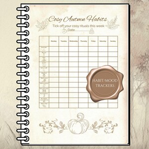 Könnte beinhalten: Ein cremefarbenes Spiralnotizbuch mit einem Wochen-Gewohnheitstracker. Die Seite zeigt den Text "Cosy Autumn Habits", Herbstillustrationen und ein Siegel mit "Habit/Mood Trackers".