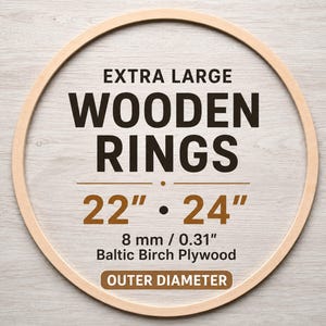 May include: A circular wooden ring made of Baltic Birch plywood. The text reads: EXTRA LARGE WOODEN RINGS 22" • 24" 8 mm / 0.31" Baltic Birch Plywood OUTER DIAMETER. The ring has a light wood grain finish and a smooth, rounded surface profile.