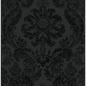 May include: A dark charcoal gray wallpaper featuring a repeating damask pattern. The design consists of intricate, symmetrical floral and scrollwork motifs in a slightly lighter shade of gray, creating a subtle contrast against the black background.
