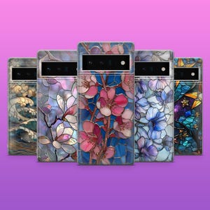 May include: Five phone cases with stained-glass designs. The cases feature floral, wave, and galaxy patterns in blue, pink, and purple. Each case has a camera cutout.