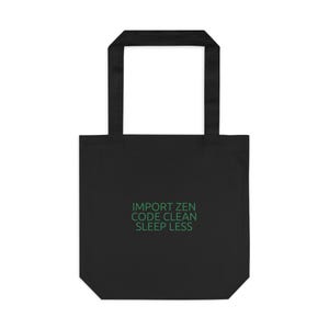 Peut inclure: Sac fourre-tout noir avec le texte "IMPORT ZEN CODE CLEAN SLEEP LESS" en vert. Le sac a deux poignées et est fait d'un matériau robuste.