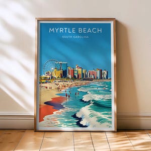 Op de afbeelding: Een ingelijste kunstprint met een illustratie van Myrtle Beach, South Carolina. De afbeelding toont een reuzenrad, kleurrijke gebouwen, een zandstrand en oceaangolven onder een helderblauwe lucht. De tekst "MYRTLE BEACH SOUTH CAROLINA" staat bovenaan.