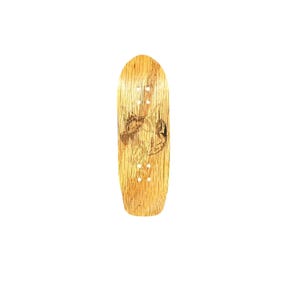 May include: A wooden fingerboard with a light brown finish. The board features a detailed graphic design and four small holes for mounting. The fingerboard is designed for performing tricks.