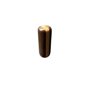 May include: A cylindrical wooden knob with a dark brown body and a light brown stripe around the top. The knob is made of wood and has a smooth finish. The product is likely a furniture or cabinet hardware component.