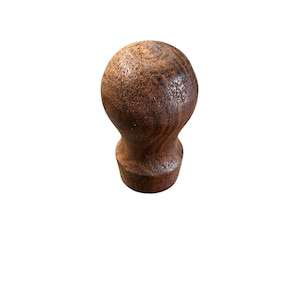 May include: A wooden knob with a rounded top and a flared base. The knob is a rich brown color with visible wood grain patterns. The design is simple and classic, suitable for furniture or decorative use.
