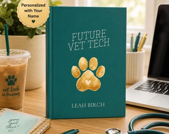 May include: A teal hardcover journal with the text FUTURE VET TECH and LEAH BIRCH printed in white. A gold watercolor paw print with a small white heart in the center is featured on the cover. The journal is placed on a desk with a laptop and stethoscope.