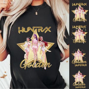 May include: Black t-shirt featuring the text "HUNTR/X" above a gold star graphic with three cartoon figures and the word "Golden" in gold script. Additional smaller graphics are visible on the right side of the image.