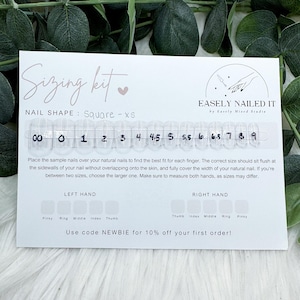 May include: A white sizing kit card with clear sample nails for nail sizing. The card reads "Sizing kit" and "EASILY NAILED IT". The nail shape is "Square - xs". The card includes instructions and a size guide from 00 to 9. The text "Use code NEWBIE for 10% off your first order!" is also visible.