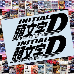 May include: A light blue sticker featuring the text "INITIAL D" in black, with Japanese characters. The sticker is layered over a collage of car magazines, creating a dynamic and eye-catching design.