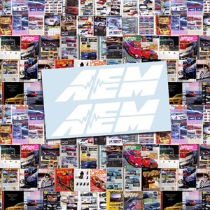 May include: A collage of car magazine covers forms the background for a light blue rectangle with the white text "NEM NEM". The text has a stylized waveform design incorporated into the letters, suggesting a connection to automotive performance or technology.