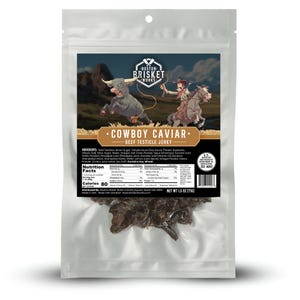 May include: A clear plastic package of "Cowboy Caviar" beef testicle jerky. The package features a cartoon illustration of a cowboy riding a horse and a bull. The text "Boston Brisket Works" is at the top.