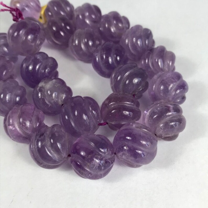 14 Carved Amethyst Strand Spiral Cut
