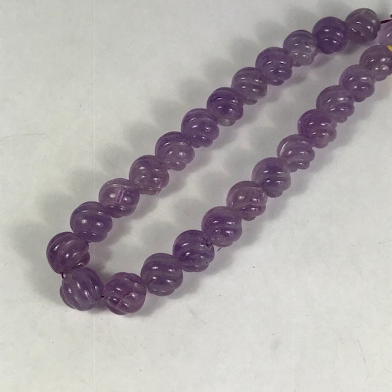 14 Carved Amethyst Strand Spiral Cut