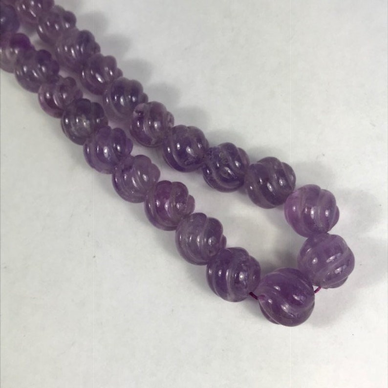14 Carved Amethyst Strand Spiral Cut