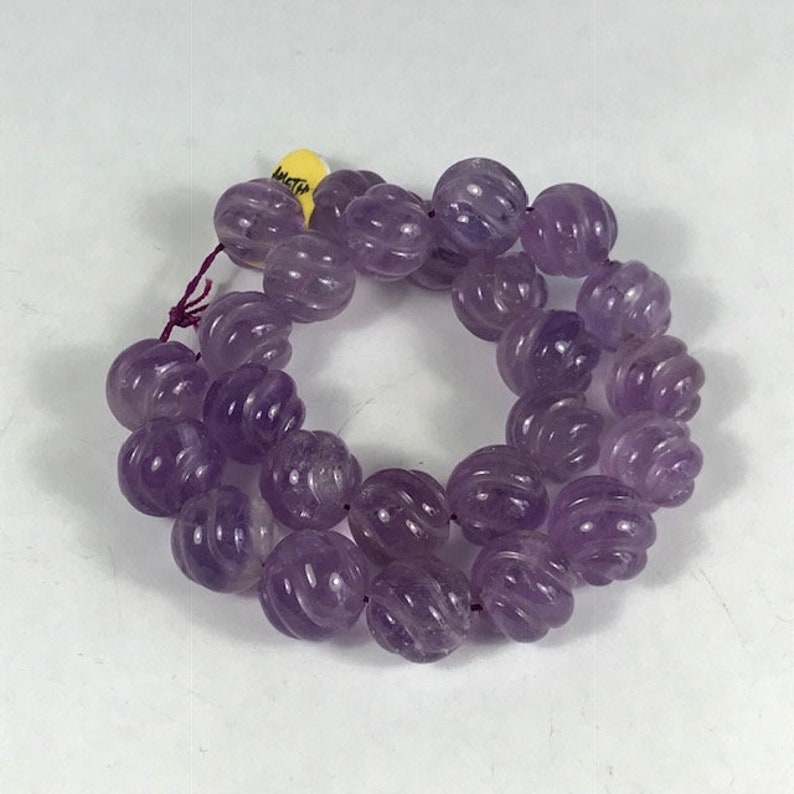 14 Carved Amethyst Strand Spiral Cut