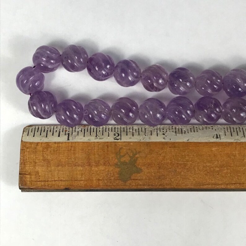 14 Carved Amethyst Strand Spiral Cut