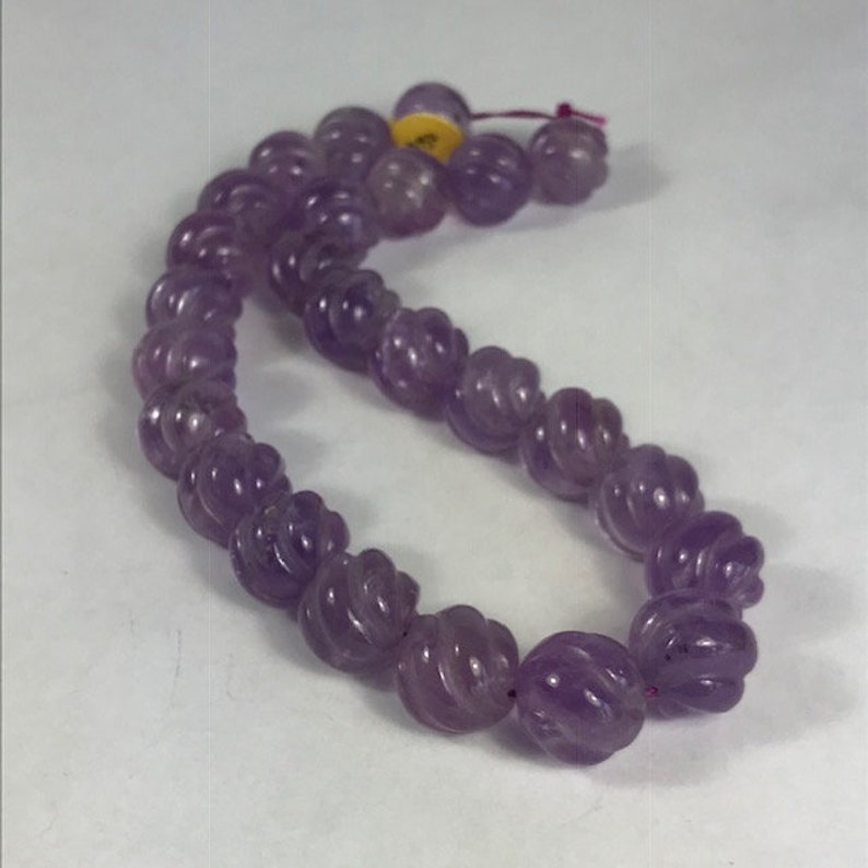 14 Carved Amethyst Strand Spiral Cut